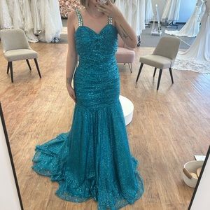 Tiffany prom dress size 10. Mermaid style sequin dress with open back
